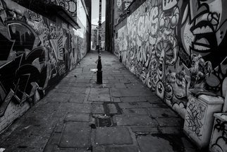 Barry Hurley; Paint Alley, 2018, Original Photography Black and White, 24 x 16 inches. Artwork description: 241 An Alley from the East End of London. Originally whitewashed, the locals added their own touch...