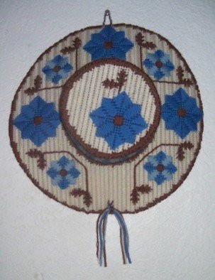 Kathie Freeman; Country Cover, 2012, Original Fiber, 14 x 16 inches. Artwork description: 241  Blue and Beige Needlepoint HatThis lovely wall decor is worked over plastic canvas and measures 14 inches in diameter. Perfect for bedroom or family room ...