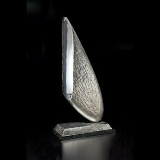 Ted Schaal; Sliver, 2013, Original Sculpture Steel, 16 x 31 inches. Artwork description: 241 This piece was inspired by an article I read about an asteroid that is speculated to be 100 stainless steel.  This is a Sliver of that asteroid that plummeted to Earth and then sliced and polished. ...