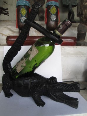 Dimitri Sonkeng; Wine Holder Crocodile, 2015, Original Sculpture Wood, 12 x 38 cm. Artwork description: 241  A Wine holder carved with ebony wood  ...