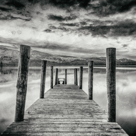 Jonathan O'hora: 'derwent water', 2017 Black and White Photograph, Landscape. Artist Description: Photography: Black   White and Digital on Paper.Derwent Water, view from jetty at dusk.Archival Print 20 x 13. 5  Limited edition of 50 photographic prints. Each print is made from Kodak Metallic Paper with an archival quality of 75 years.Derwentwater  or Derwent Water  is one of ...
