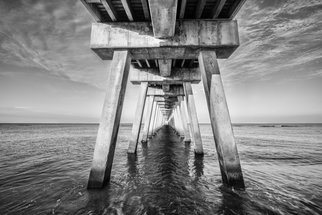 Jon Glaser: 'Venice Below the Pier II', 2014 Black and White Photograph, Landscape.  This pier was located in Venice, Florida. I photographed this in the morning just as the sun was coming up.This limited- edition photograph, measuring approximately 16x24, is printed on fade- resistant Museo Silver Rag paper that has no optical brighteners. The image has been varnished with a protective coating...