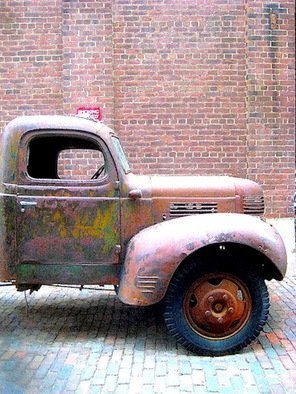 Ronnie Caplan: 'Truckin', 2014 Color Photograph, Automotive. A retro, antique feeling emanates from this semi- dilapidated truck, parked on a field of cobblestones, as if fixed in time.  .  .  Antiquated and enduring, the vehicle still stands bold against a brick wall in an almost monochromatic composition that features dulcet hues of brown, ochre, rust, ash.  .  .  ...