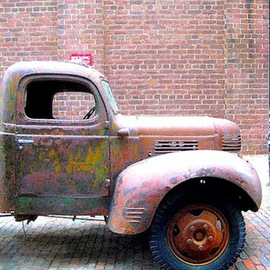 Ronnie Caplan: 'Truckin', 2014 Color Photograph, Automotive. Artist Description: A retro, antique feeling emanates from this semi- dilapidated truck, parked on a field of cobblestones, as if fixed in time.  .  .  Antiquated and enduring, the vehicle still stands bold against a brick wall in an almost monochromatic composition that features dulcet hues of brown, ochre, rust, ash.  .  .  ...