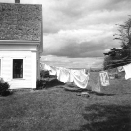 Ruth Zachary: 'Laundry Day Rain Coming', 2012 Black and White Photograph, Landscape. Artist Description: Laundry on the line, traditional New England cottage looking out to sea, billowy cloud bank threatening rain.  ...