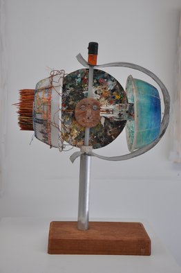 Micha Nussinov; Scarecrow, 2010, Original Sculpture Mixed, 51 x 61 cm. Artwork description: 241   A double face with opposing spheres rotating on a pole. Made from recycled matters, wood, aluminume tube, plastic ricota draining dishes, colour mixing palate, wooden sticks, paint tube, acrylic spheres, epoxy, oil paint, screw, wires and. . . ...