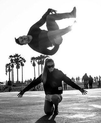 Dick Drechsler; The Flying Tourist, 2018, Original Photography Black and White, 11 x 14 inches. Artwork description: 241 This picture was captured in Venice, CA as a tourist was exhibiting his athletic skills. ...