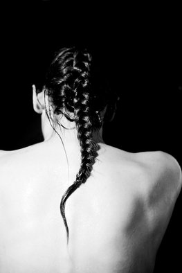 Aliona Kuznetsova: 'alone', 2014 Black and White Photograph, Portrait. An image of a woman facing from the camera. Her wet, white, broad back is crossed by a braid of black hair. Her perceived emotional state is longliness and despair...