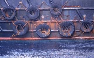 Ellen Spijkstra: '46', 2003 Color Photograph, Marine. 7 Tires chained to the side of a ship.Blue- grey and rusty colors.Laminated with a clear, semi- matt, UV protection layer. ...