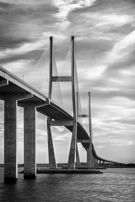 Jon Glaser: 'Lanier Bridge at Sunset II', 2016 Black and White Photograph, Landscape.  While in south Georgia, near Jekyll Island, this photograph showed the leading lines on the Sydney Lanier Bridge. This limited- edition photograph, measuring approximately 16x24, is printed on fade- resistant Museo Silver Rag paper that has no optical brighteners. The image has been varnished with a protective coating that protects...