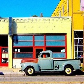 Ronnie Caplan: 'Abbott Kinney Truck', 2014 Color Photograph, Automotive. Artist Description:   This fat fendered classic Ford pickup truck sits beautifully positioned along Abbot Kinney Blvd in Venice, California. It's light gray- blue color, offset with the rust hood and yellow rim tires give it a classic, lazy feel and look. It is situated in front of a deserted ...