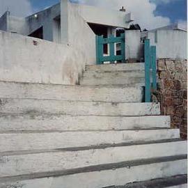 Ruth Zachary: 'Escape', 1997 Color Photograph, Architecture. Artist Description: Your eyes are drawn up the outdoor staircase!  Seemingly simple white and blue composition evokes mystery. Subtle textures, graphic horizontals contrast with verticality. Highlighted by hits of turquoise and that puff- clouded blue sky.  Isla Mujeres, Mexico. Limited edition, signed and numbered. 11 x 14 image in a ...