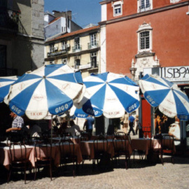 Ruth Zachary: 'Umbrellas of Lisbon', 1996 Color Photograph, Travel. Artist Description:  Cheerful, charming row of umbrellas. Charming street scene. Take a seat and order a coffee. People- watch. Interesting lines and colorful contrast.  Lisbon, Portugal.  5 x 7 in an 11 x 14 acid free mat. Signed and titled. Larger size available.  Enjoy! ...