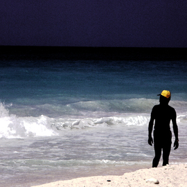 Wayne King: 'The Yellow Cap', 1980 Color Photograph, Figurative. Artist Description:  On a beach in the Carribean a local with a yellow cap creates an interesting contrast to the blue green of the ocean.One original of this image is created, signed, dated and with a certificate of authenticity. The image is used for creation of an open edition ...